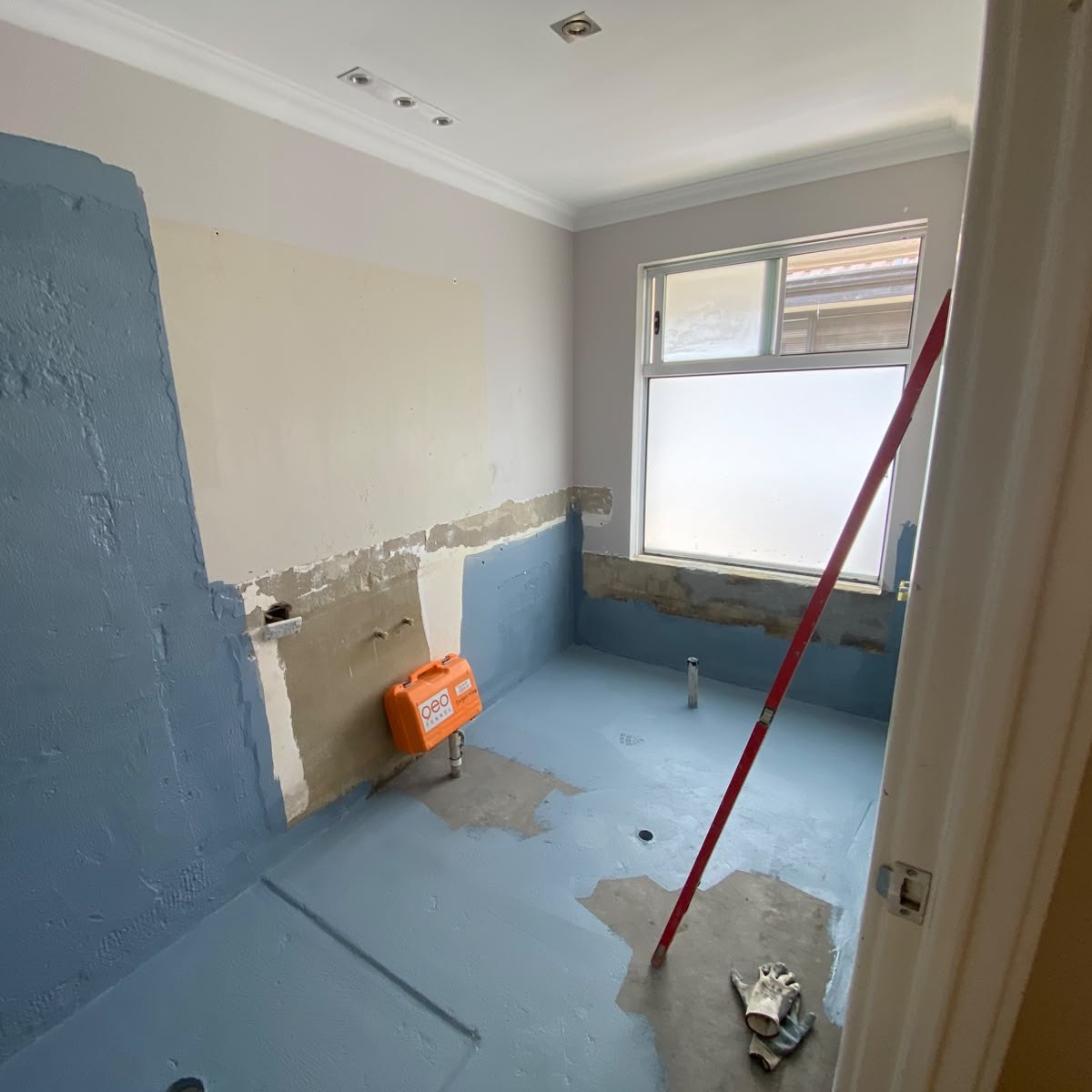 Bathroom stripped back during surface preparation and waterproofing before tiling in Perth